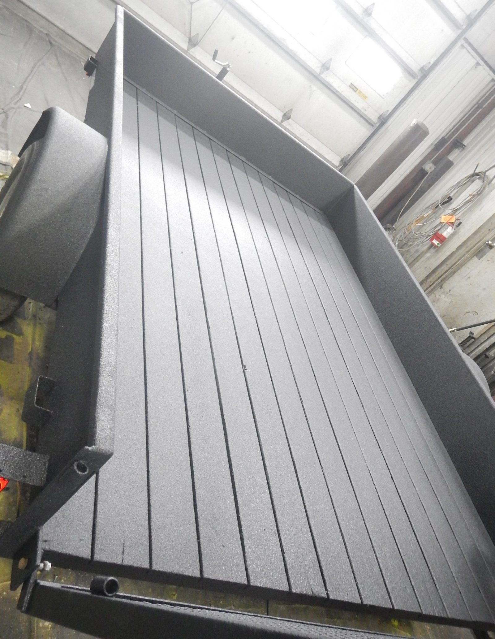 Truck camper waterproofed with flexible polyurea coating